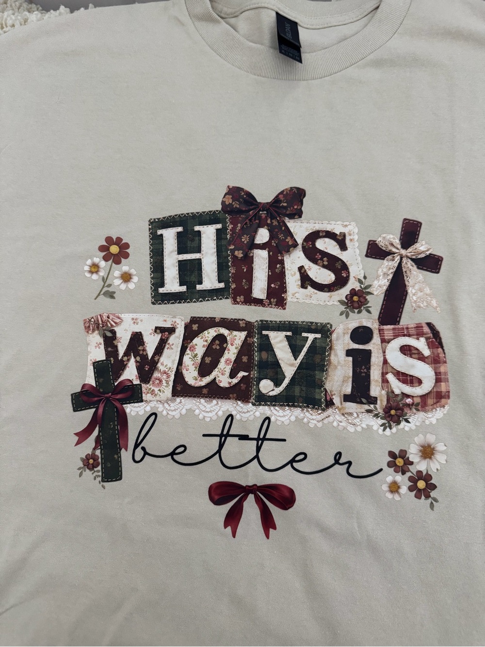 Hand Crafted cream graphic tee with burgundy and green accents